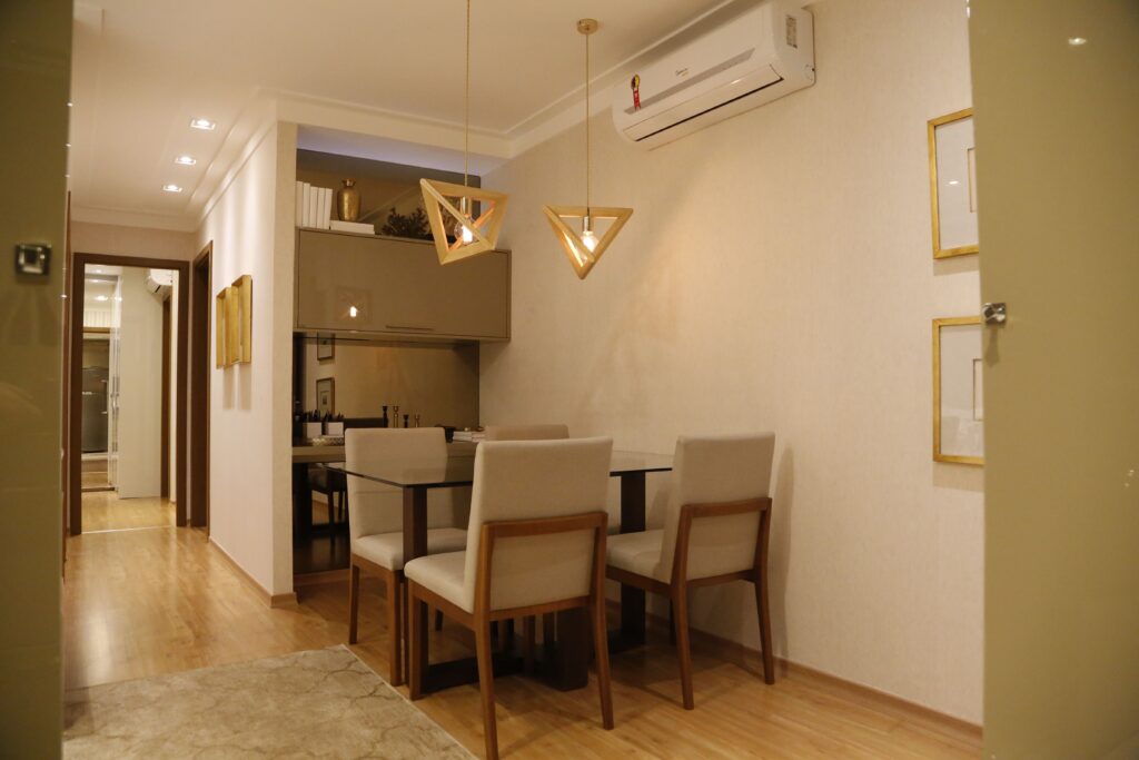 Elegant dining area with stylish lighting and modern furniture in a warm, inviting atmosphere.